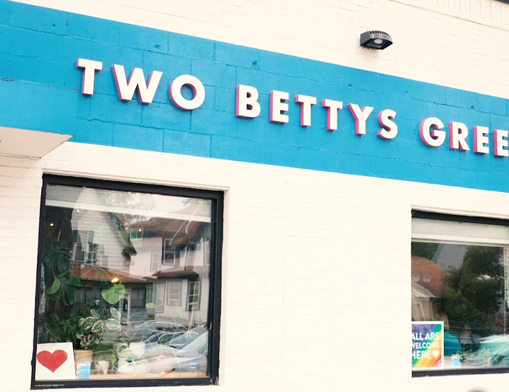 The cyan and pink Front of Two Bettys Green Cleaning HQ building in Minneapolis