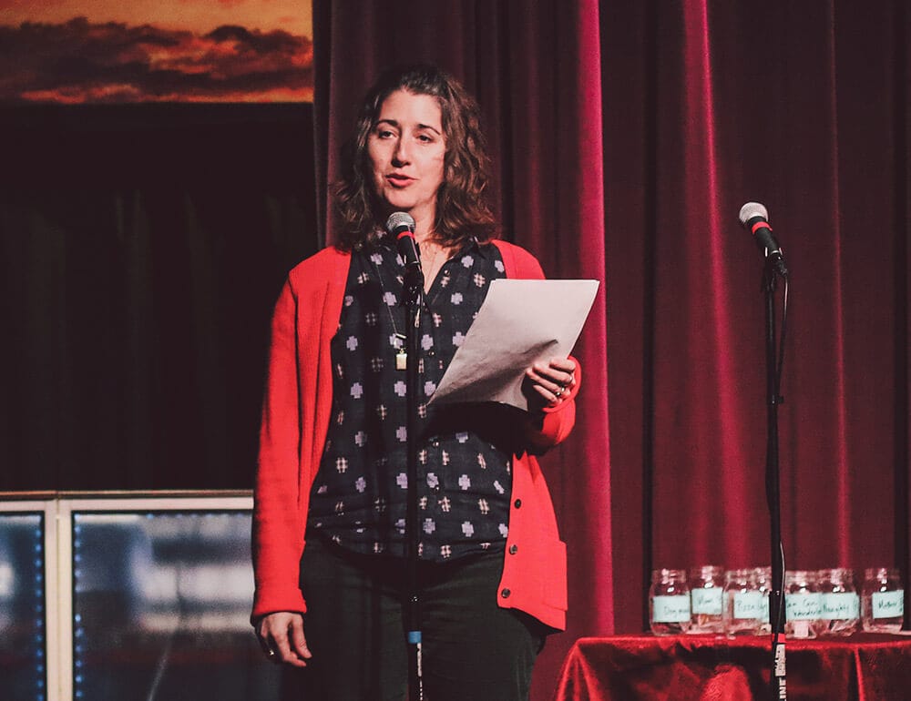 Two Bettys Green Cleaning founder & owner Anna Tsantir speaking on a stage