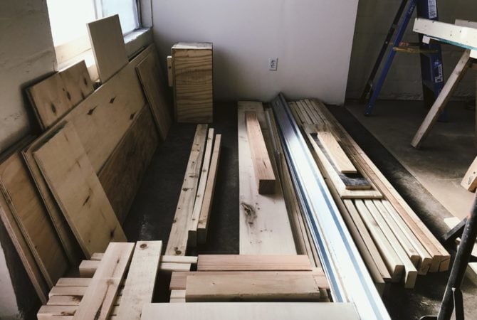 A stock-pile of salvaged and recycled wood ready to be built into shelves at Two Bettys Refill Station