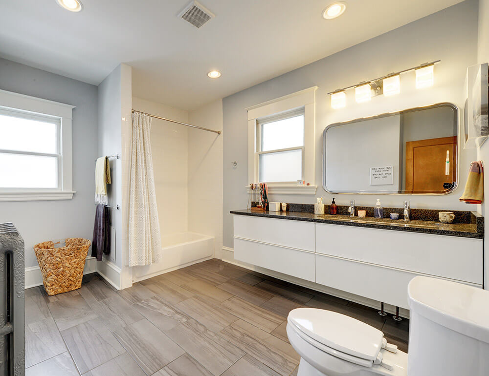 A bright, white and gray clean bathroom